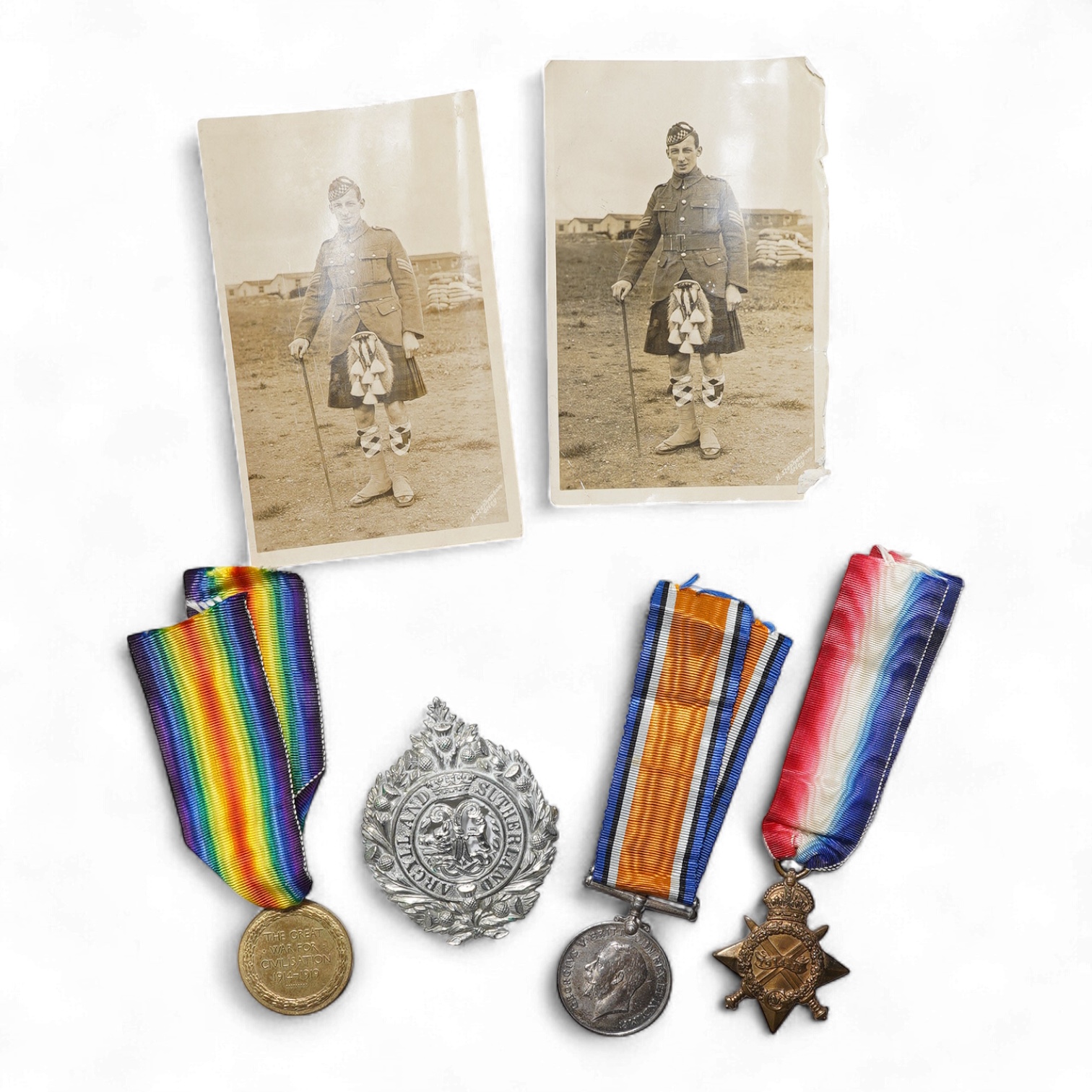 A First World War medal trio awarded to 2140 SJT. G. Watson. Argyll and Sutherland Highlanders, together with the related cap badge and two photographs of Watson in Highlanders uniform and printed as postcards